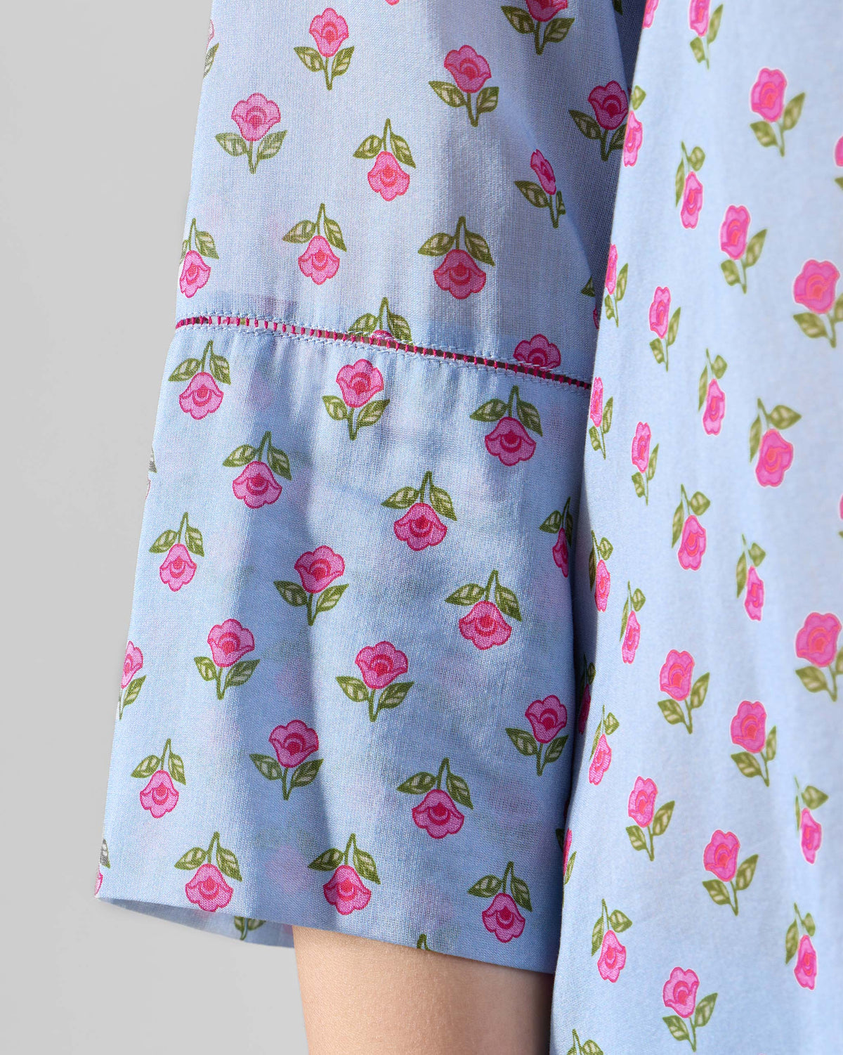 Close-up of a Kovvur Kurta Set showing pink florals and sleeve stitching.