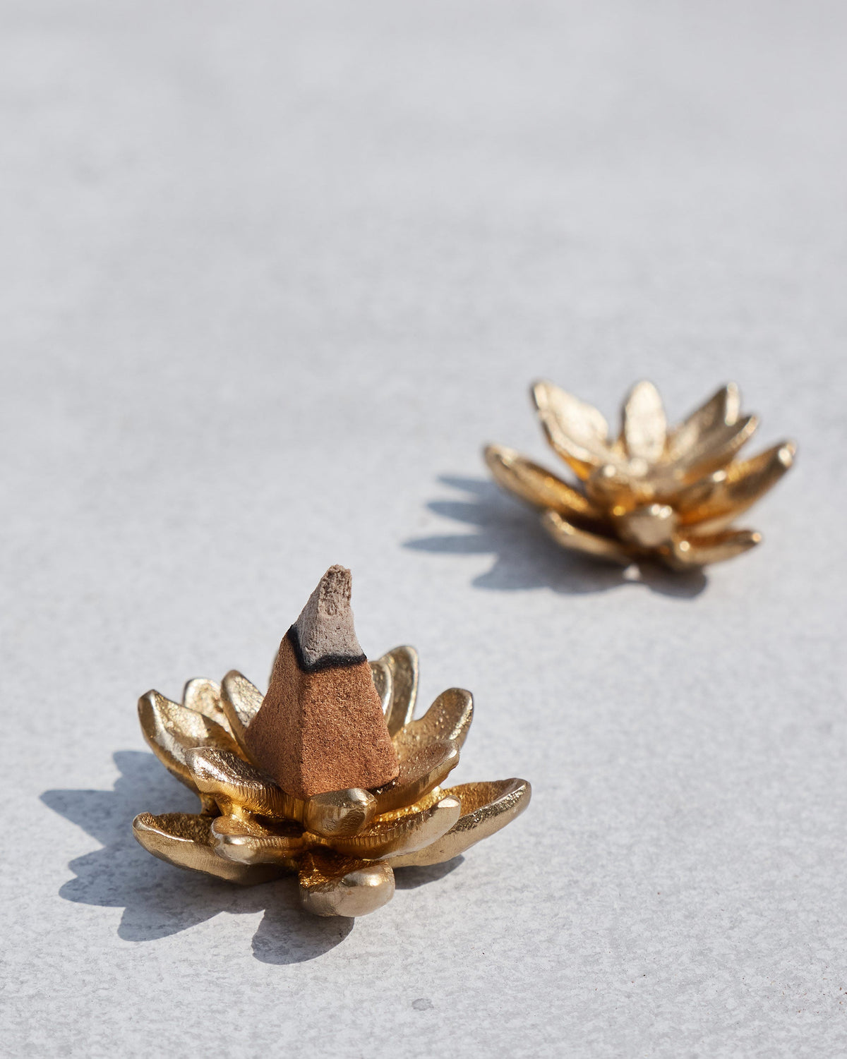 A brass Kamal incense holder.