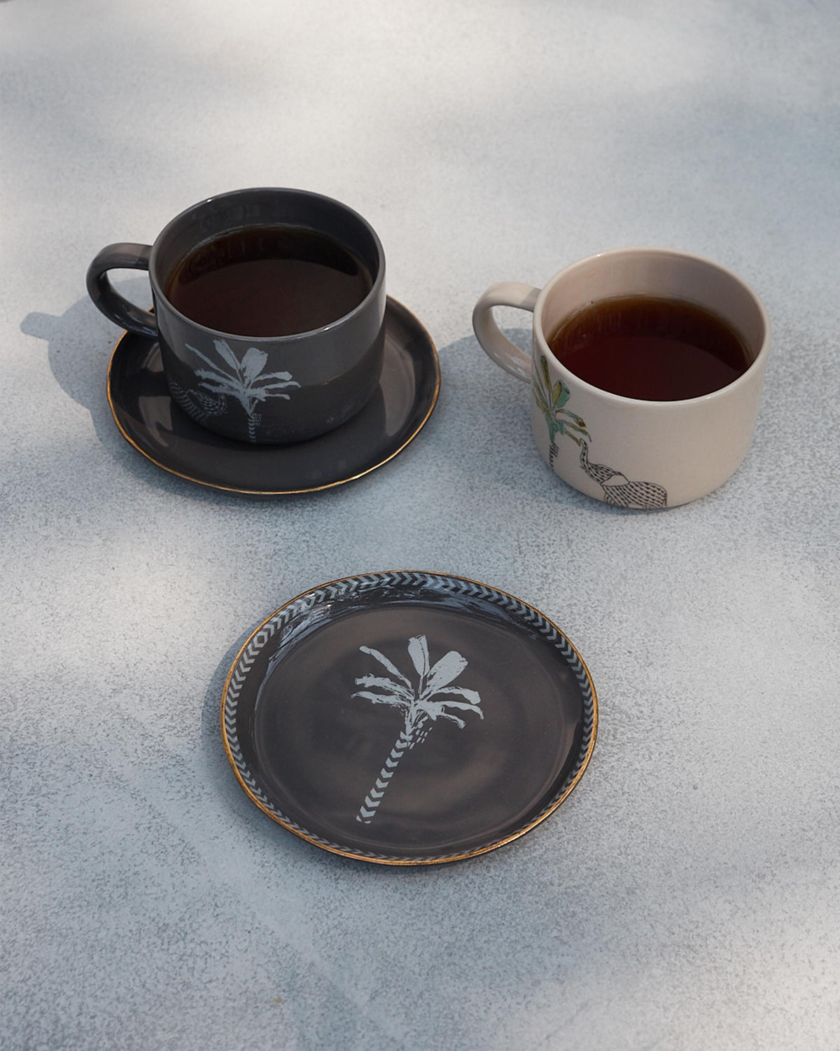 The plates beside tea cups.
