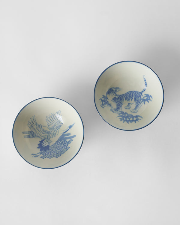 The bowls from above, a crane in one and a tiger in the other
