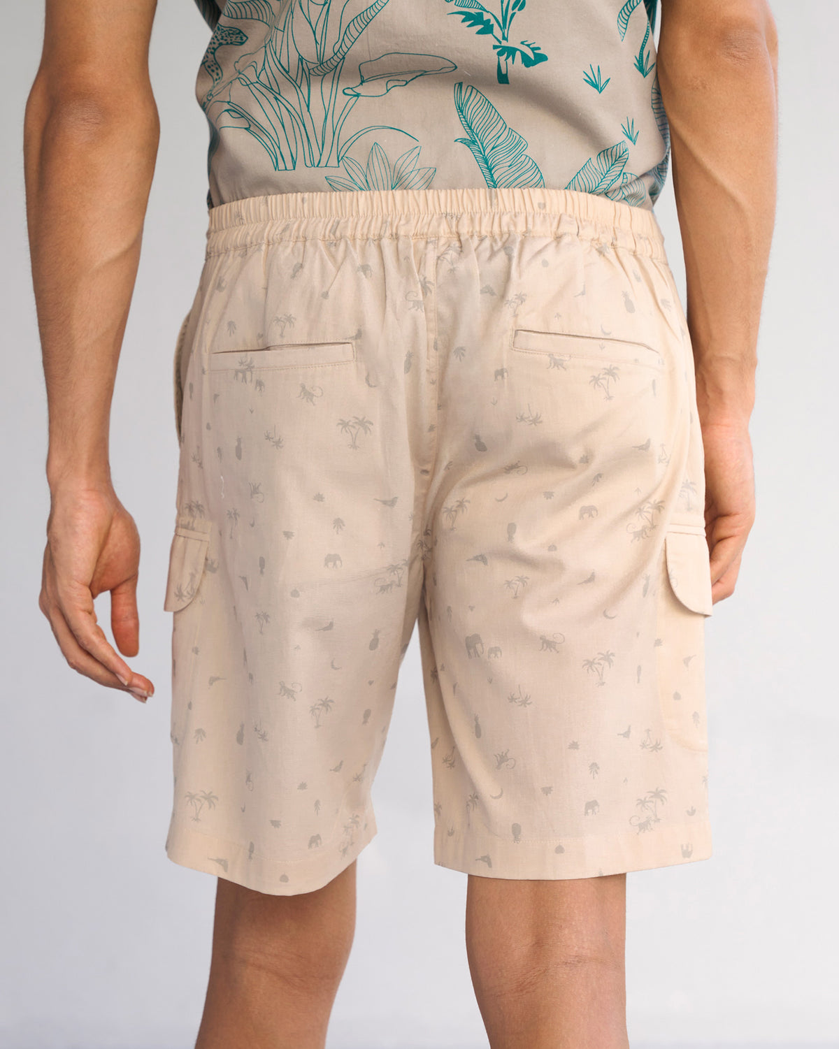 Back of beige Luna Shorts worn by a person.