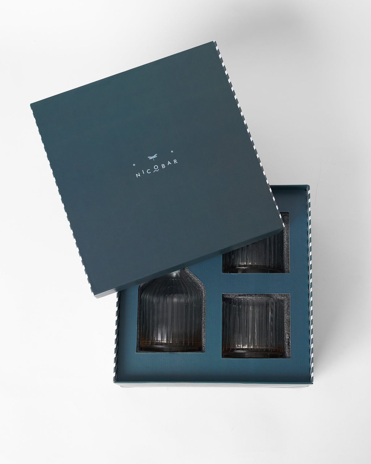 Tarang Bar Gift Set in its navy box with the lid tilted back.