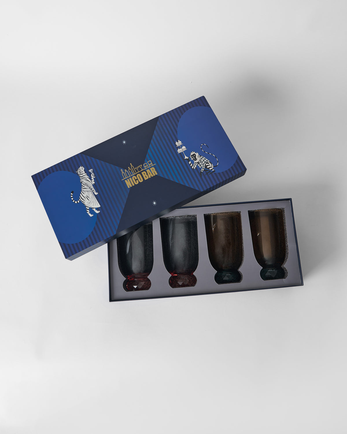Reva sharbat glasses packed in an open Nico Bar gift box.