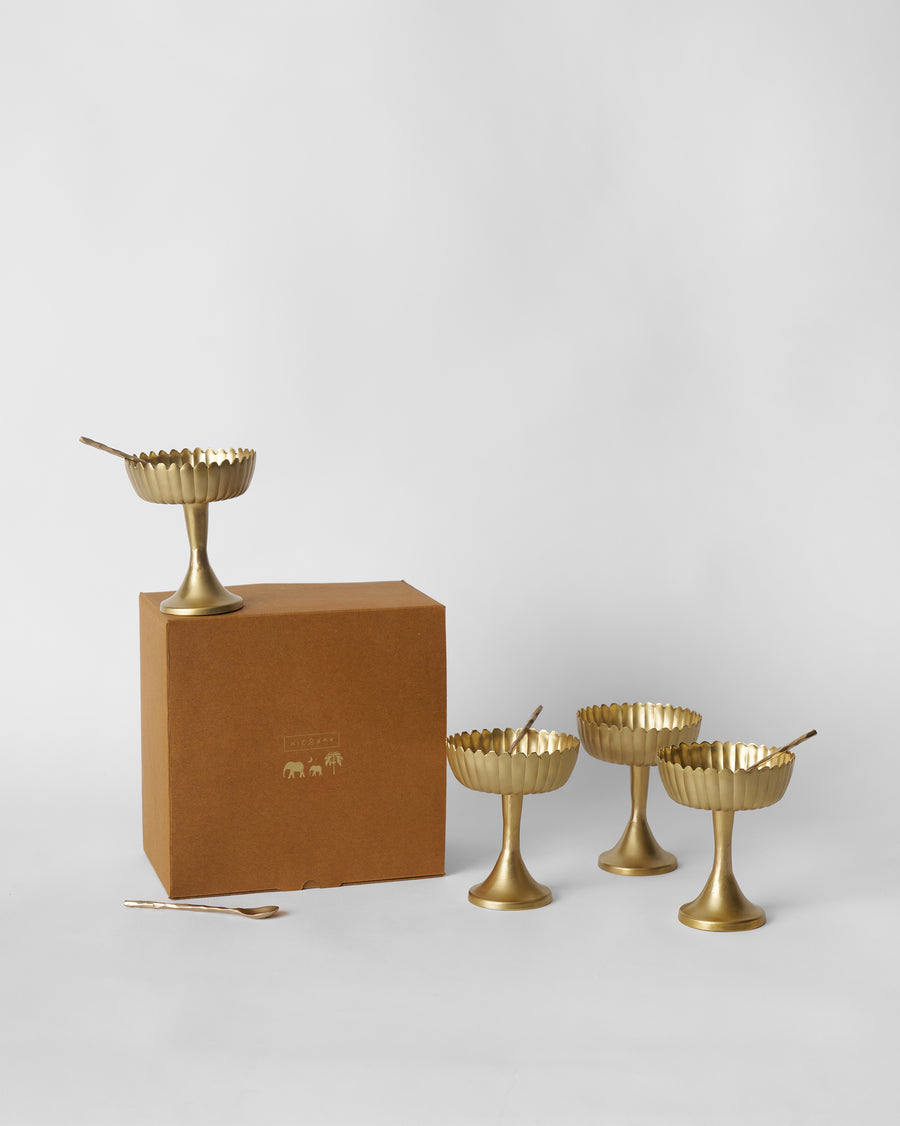The cups beside their brown box.