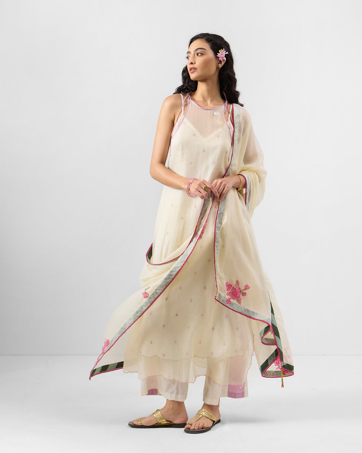 Person wearing an ivory Hera Halter Kurta Set with a sheer dupatta draped over the shoulders.