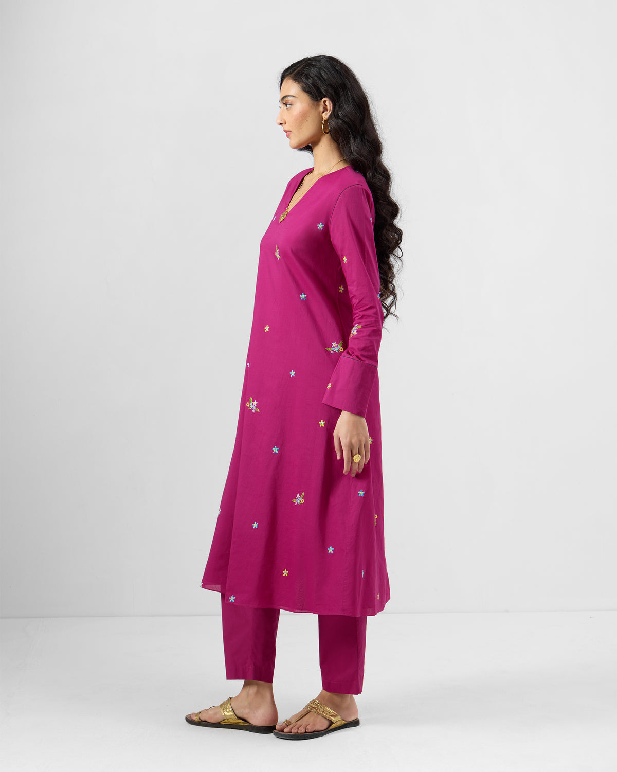 Side view of a magenta Narsa Kurta Set with scattered embroidery.