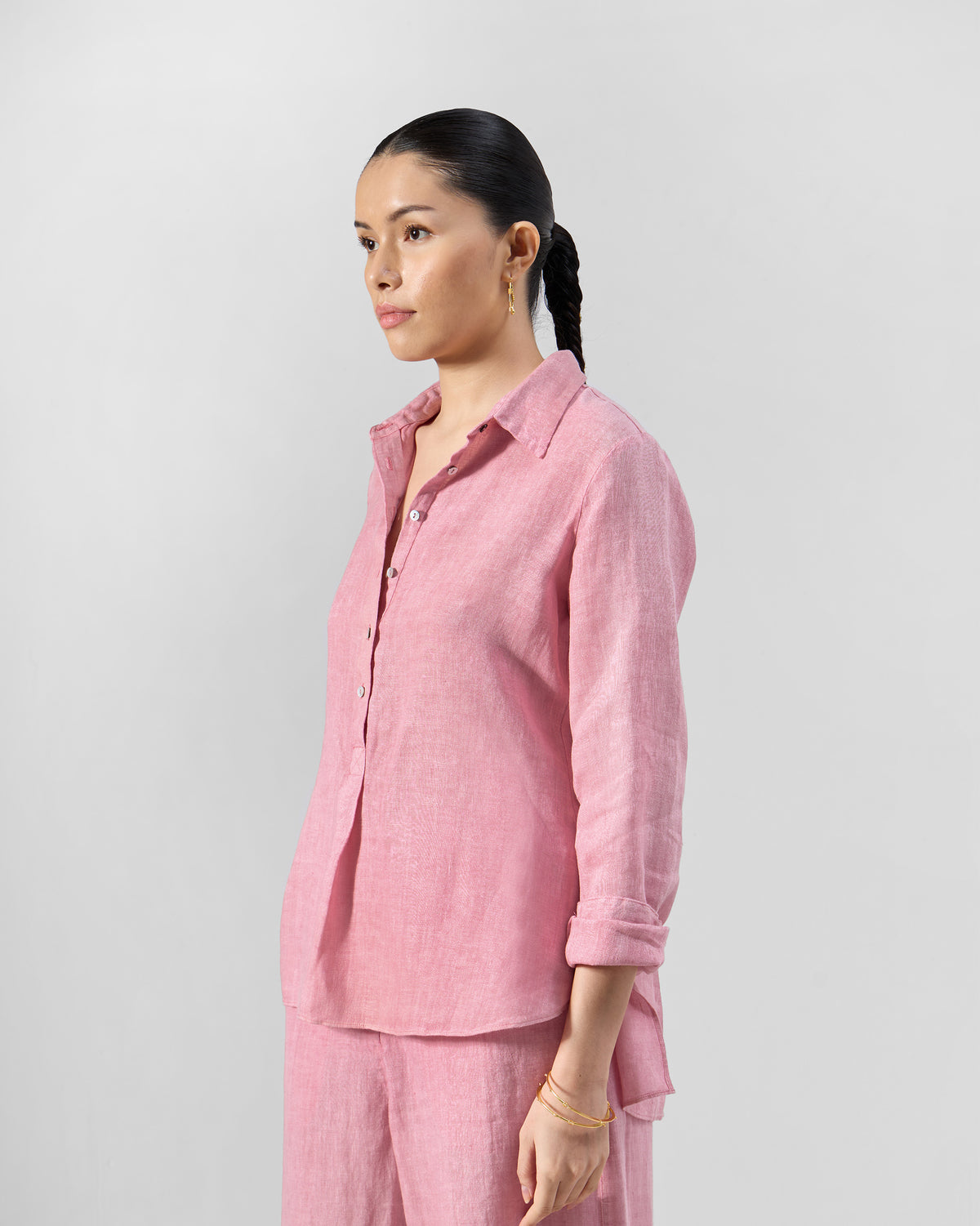 Side view of a dusty pink Mati shirt from the set.