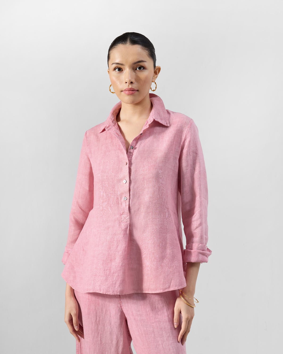 Person wearing a dusty pink Mati shirt set.