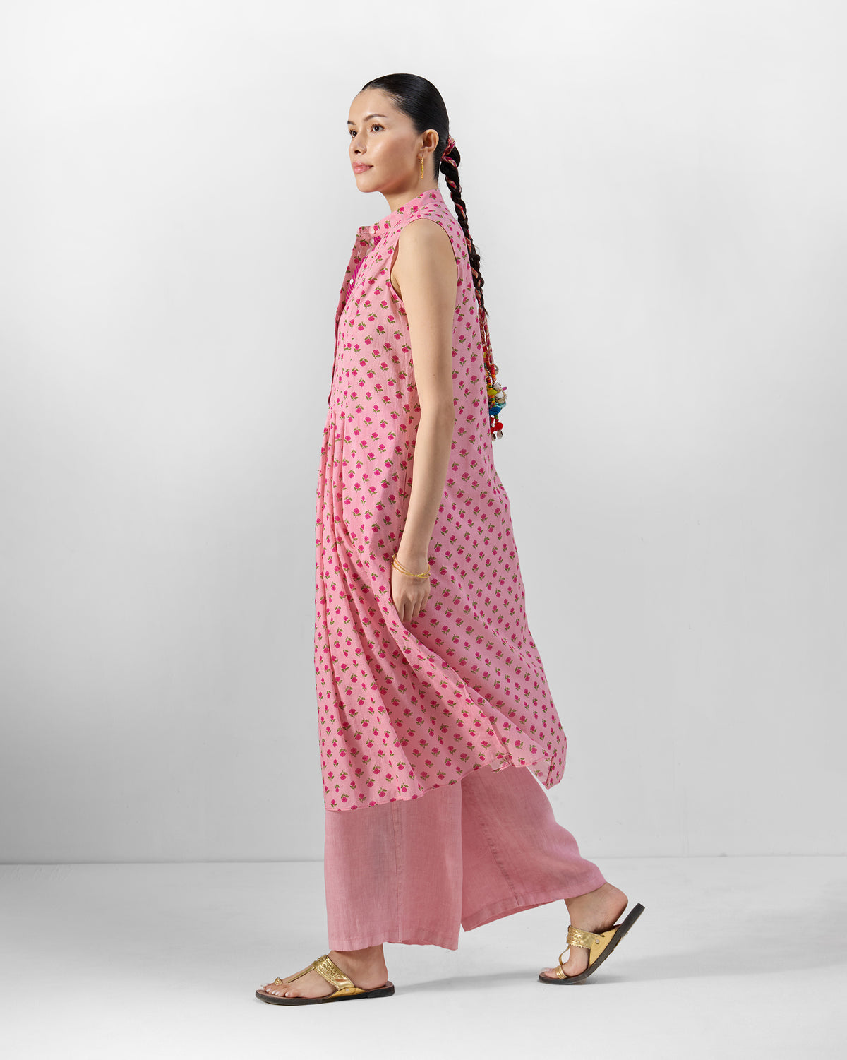 Side view of a pink floral Summer Fun kurta set in a walking pose.