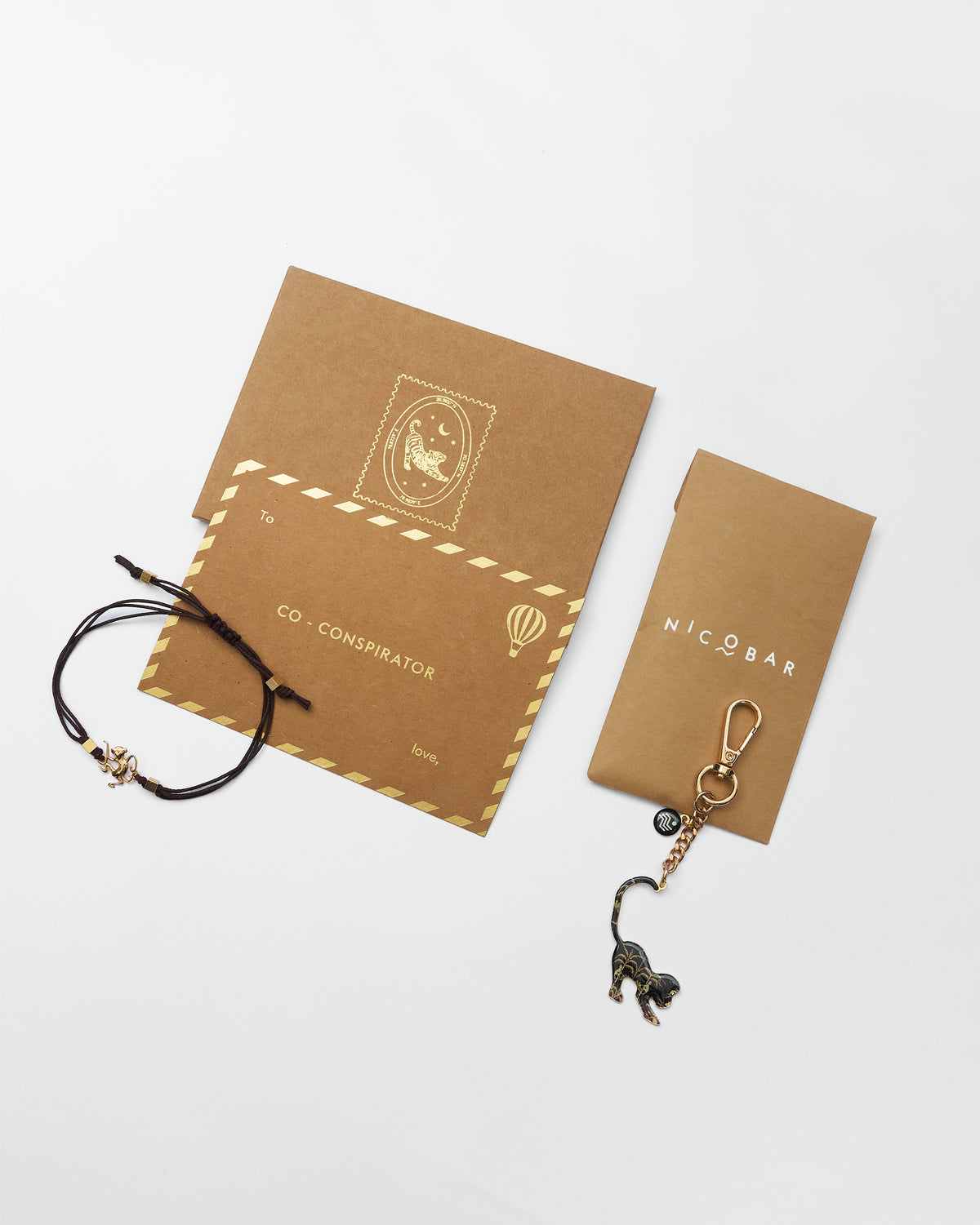Monkey Rakhi set with kraft Co-conspirator cards and gift envelopes.