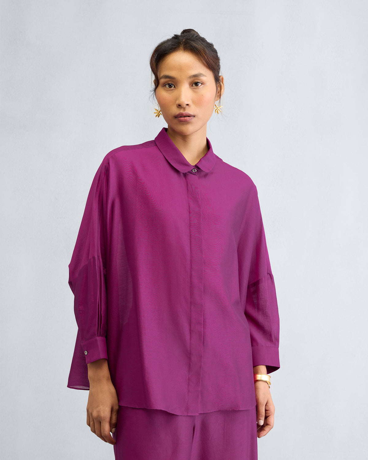 Person wearing a mulberry Boxy Shirt Set showing the boxy shirt and matching pyjamas.