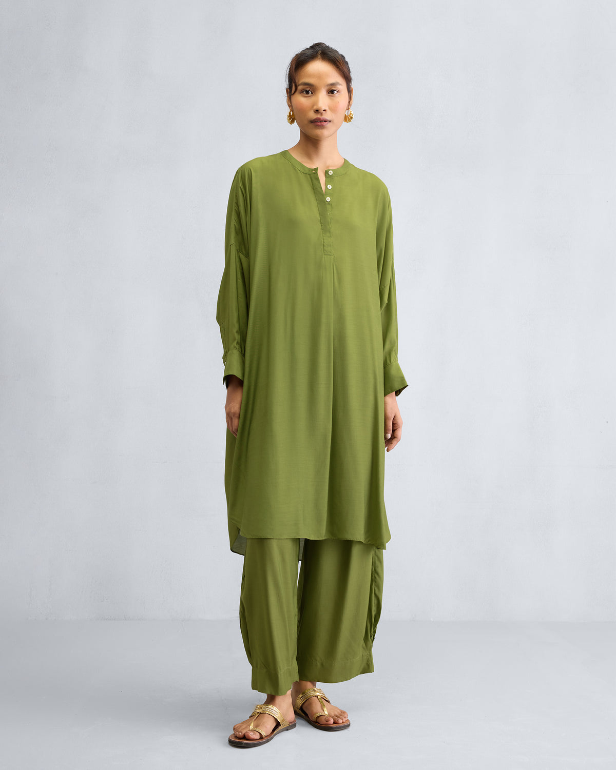 Person wearing the Lazy Sunday Tunic Set in olive green.