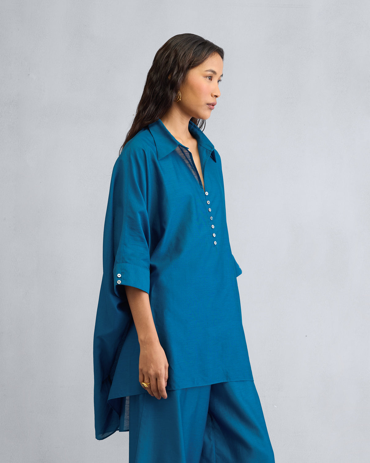 Side view of the Hala Tunic Set worn by a person.