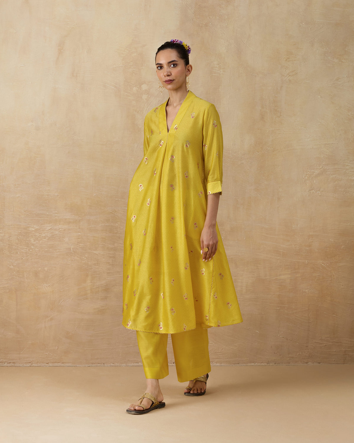 Person wearing a chartreuse Viva Kurta Set with scattered floral embroidery.
