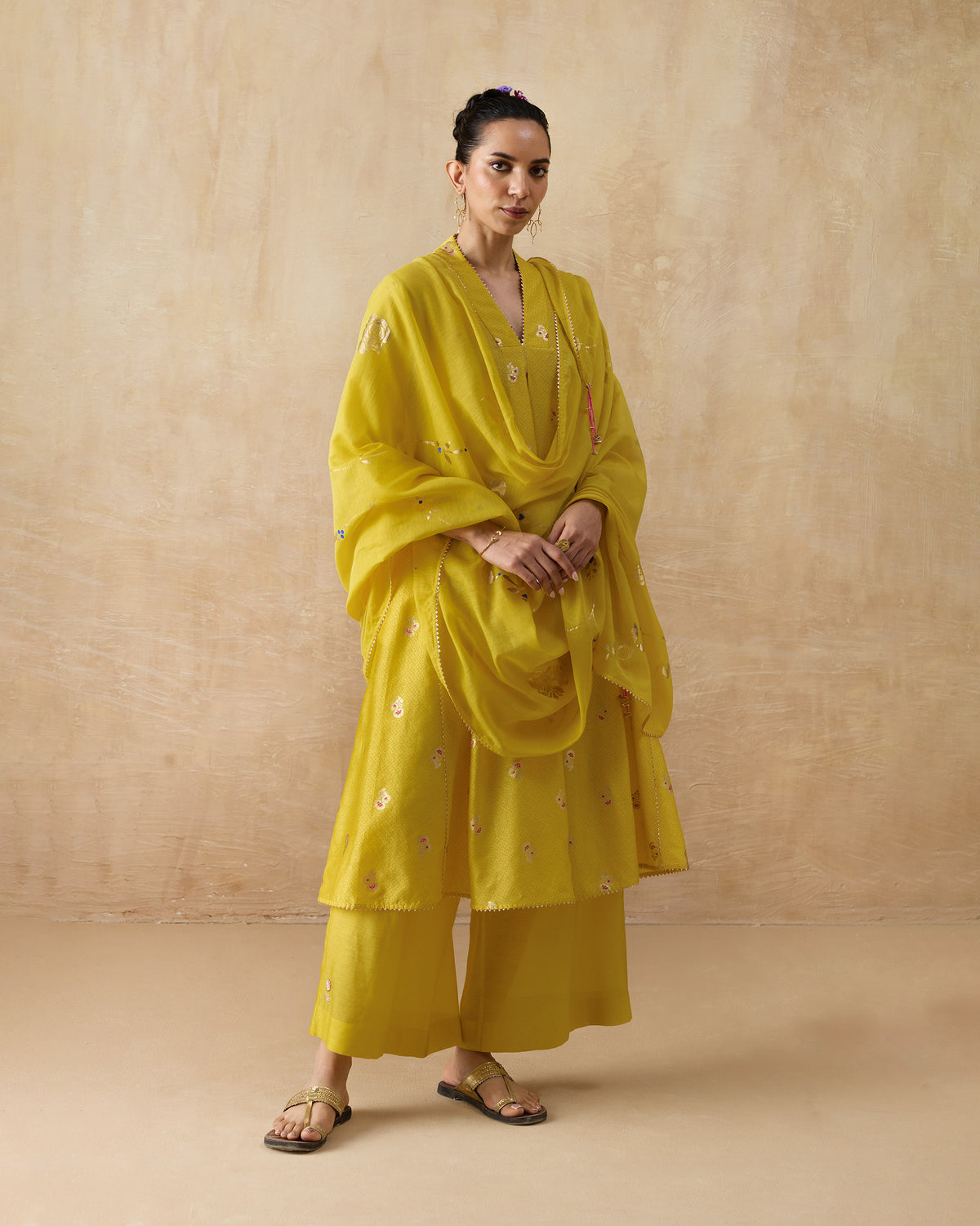 Person wearing a chartreuse Viva Kurta Set with a matching floral dupatta.