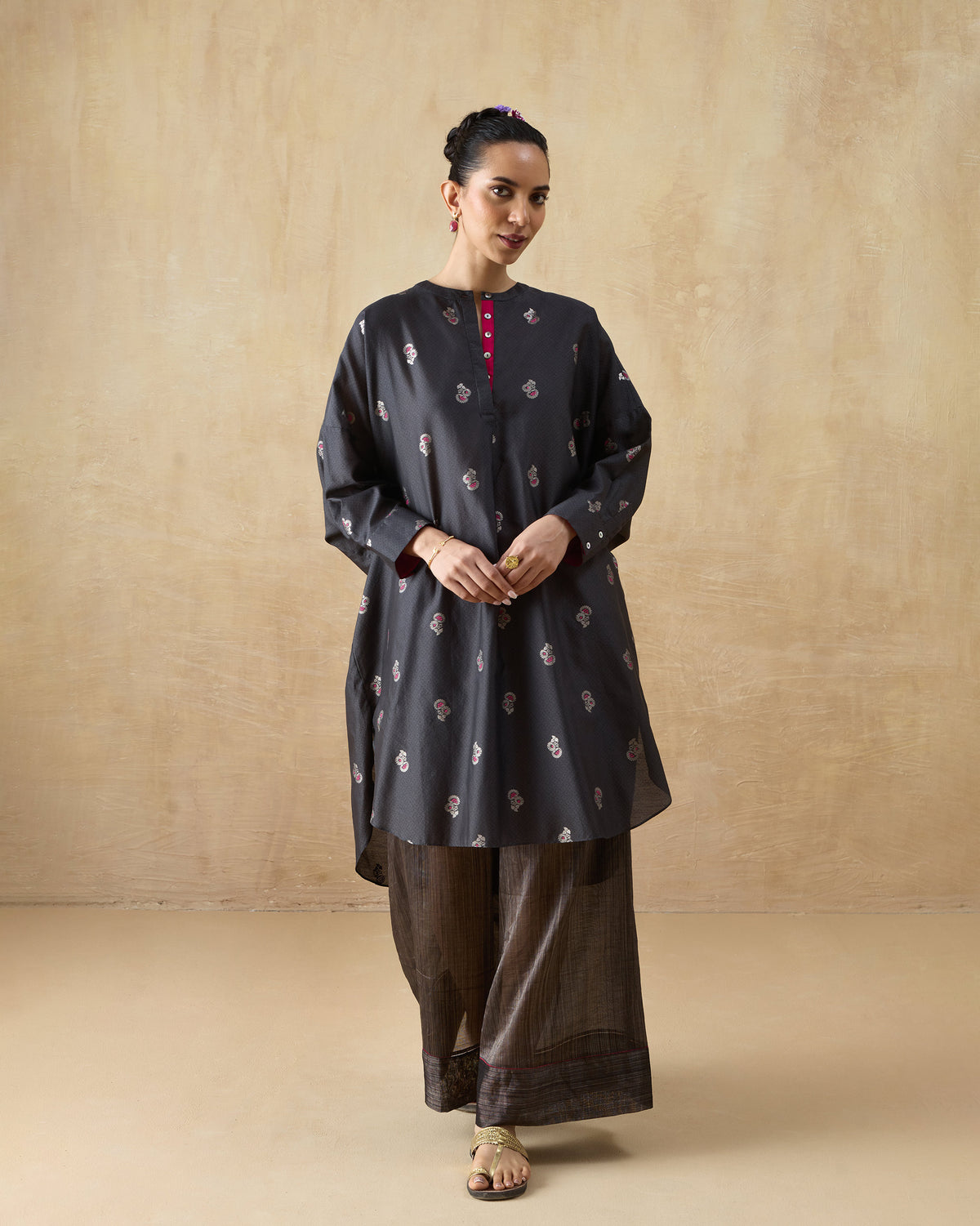 Person wearing a charcoal floral Lazy Sunday tunic set with wide-leg pants.