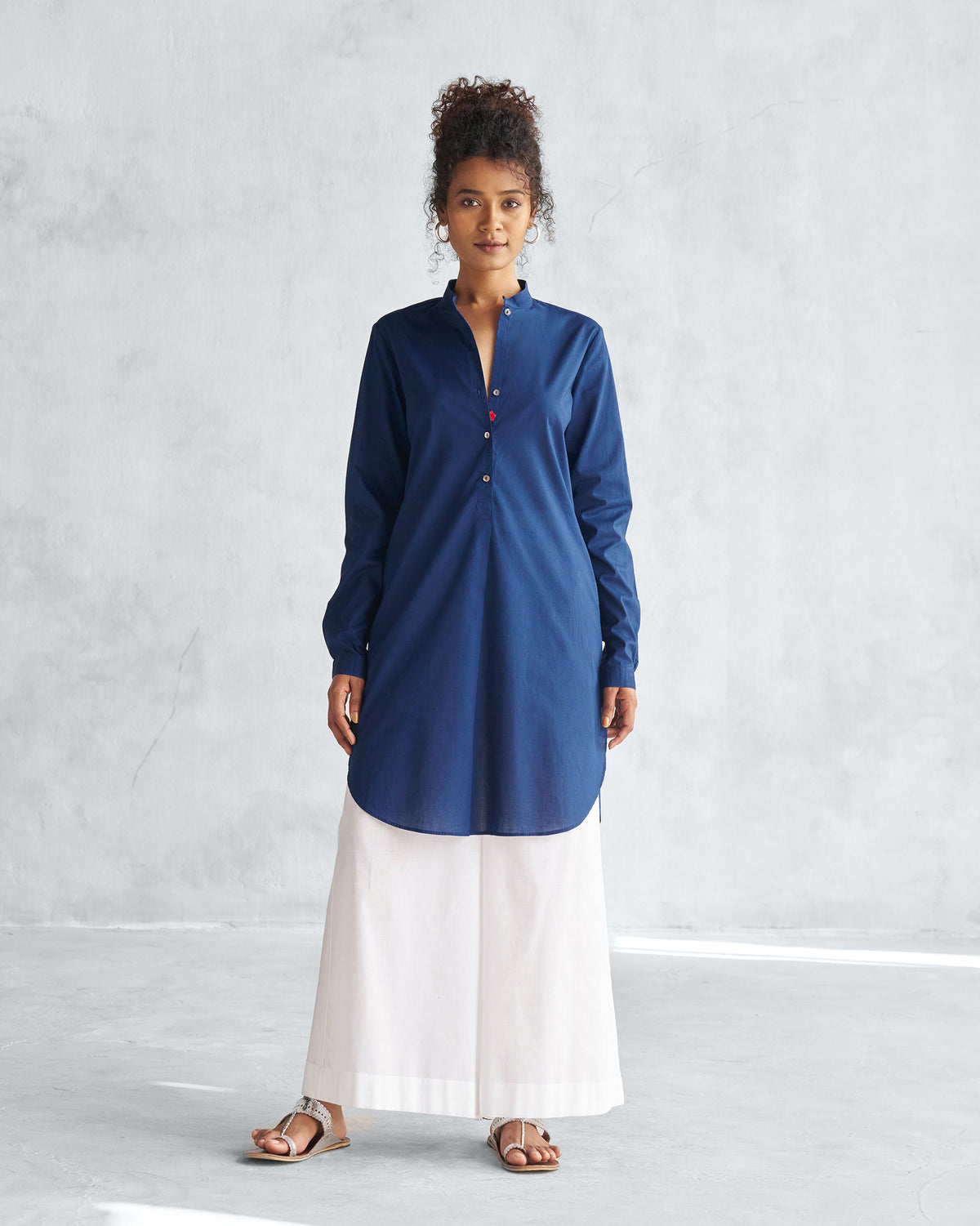 Person wearing white Basic Pyjamas with wide legs.