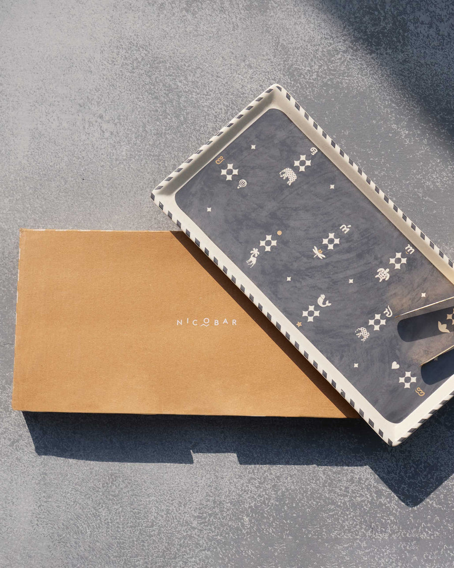 The Nizara tray resting on its brown Nicobar box