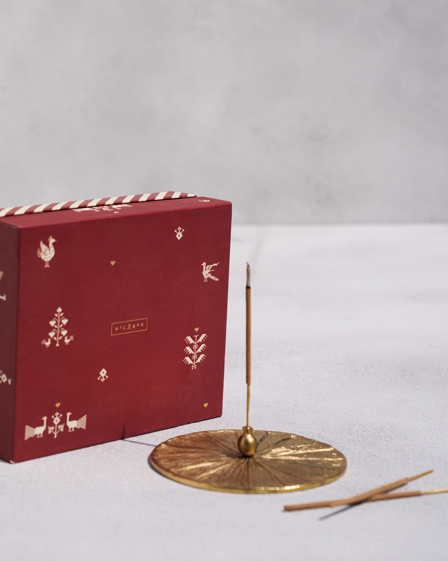 The Anar holder beside its red Nicobar gift box.