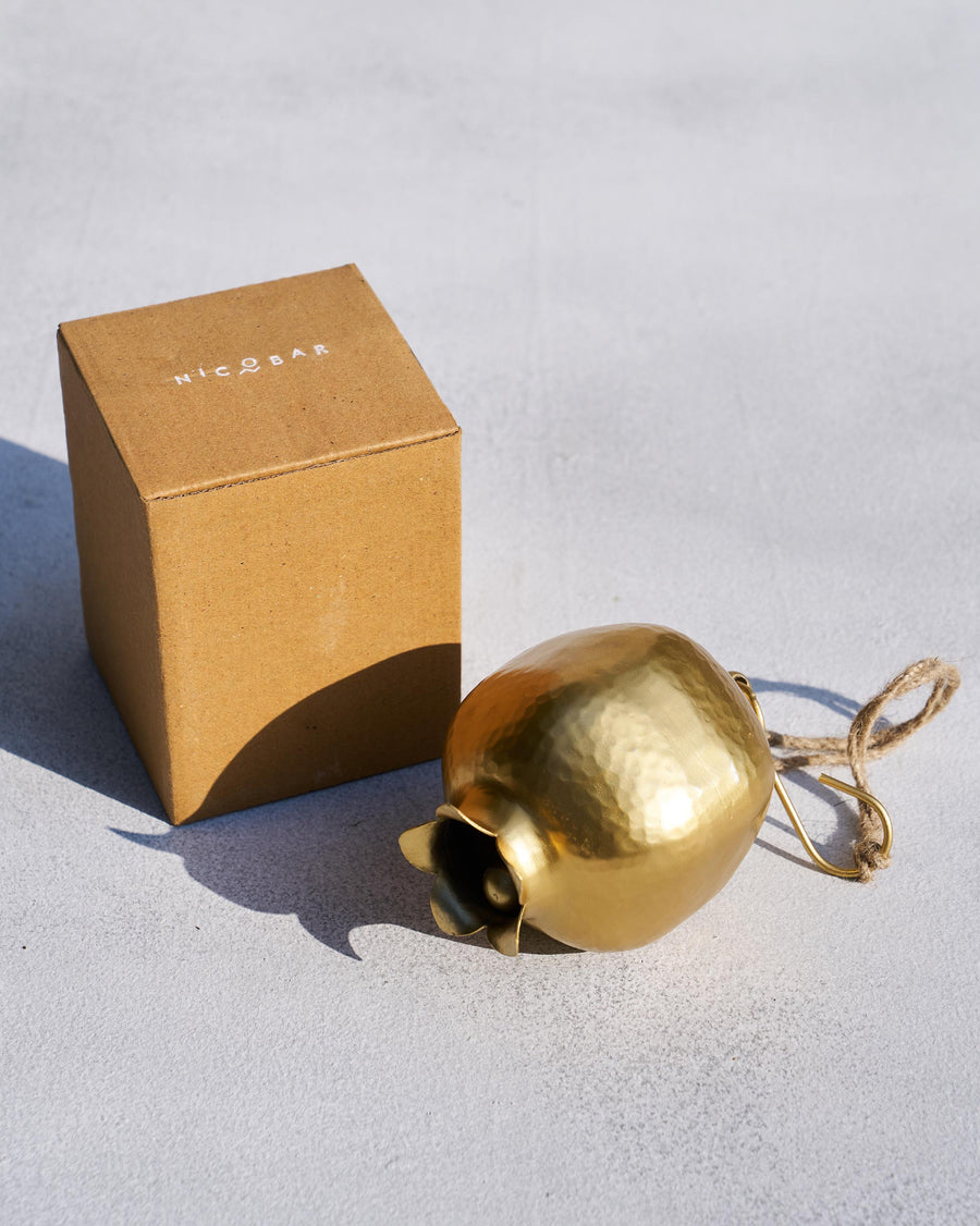 The Anar Bell beside its Nicobar gift box.
