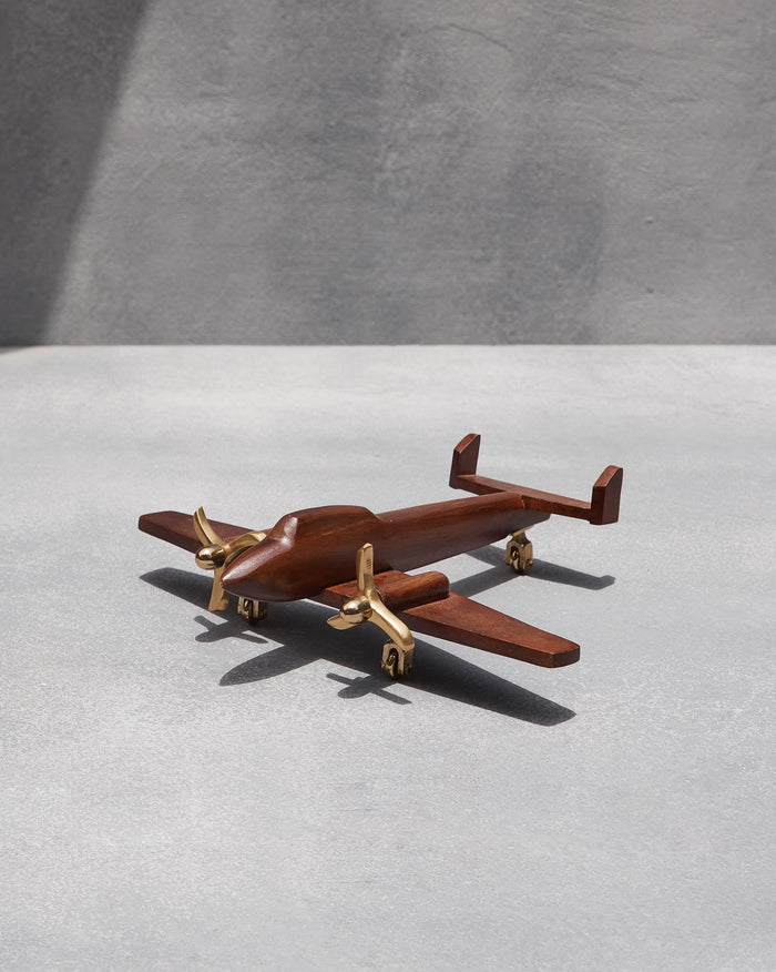 Small Beufort airplane model in wood with brass propellers.