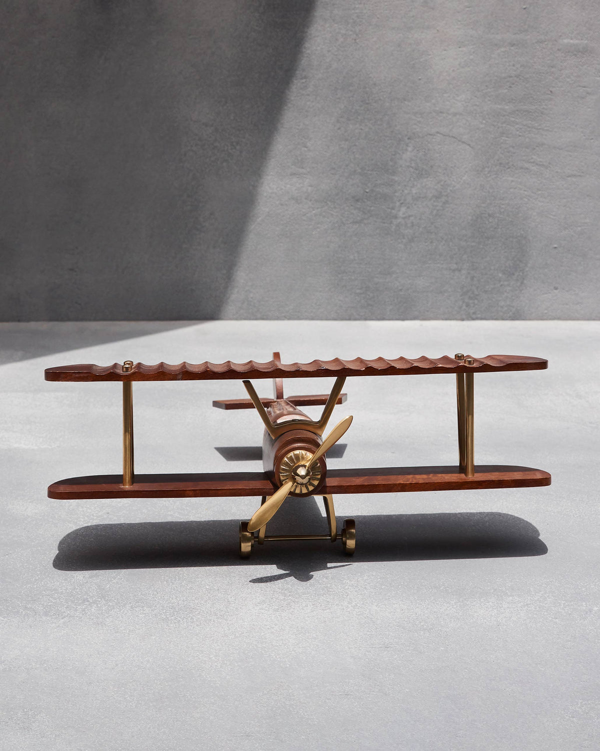 Front of a wood and brass Beufort biplane showing dual wings.