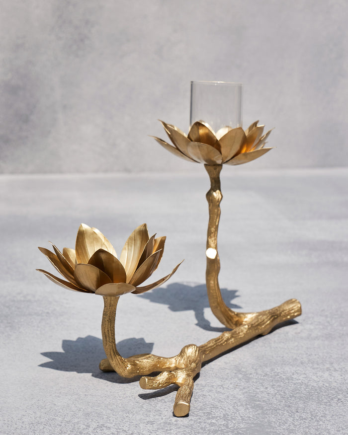Kamal tea light holder with twin gold lotuses on a textured branch base.