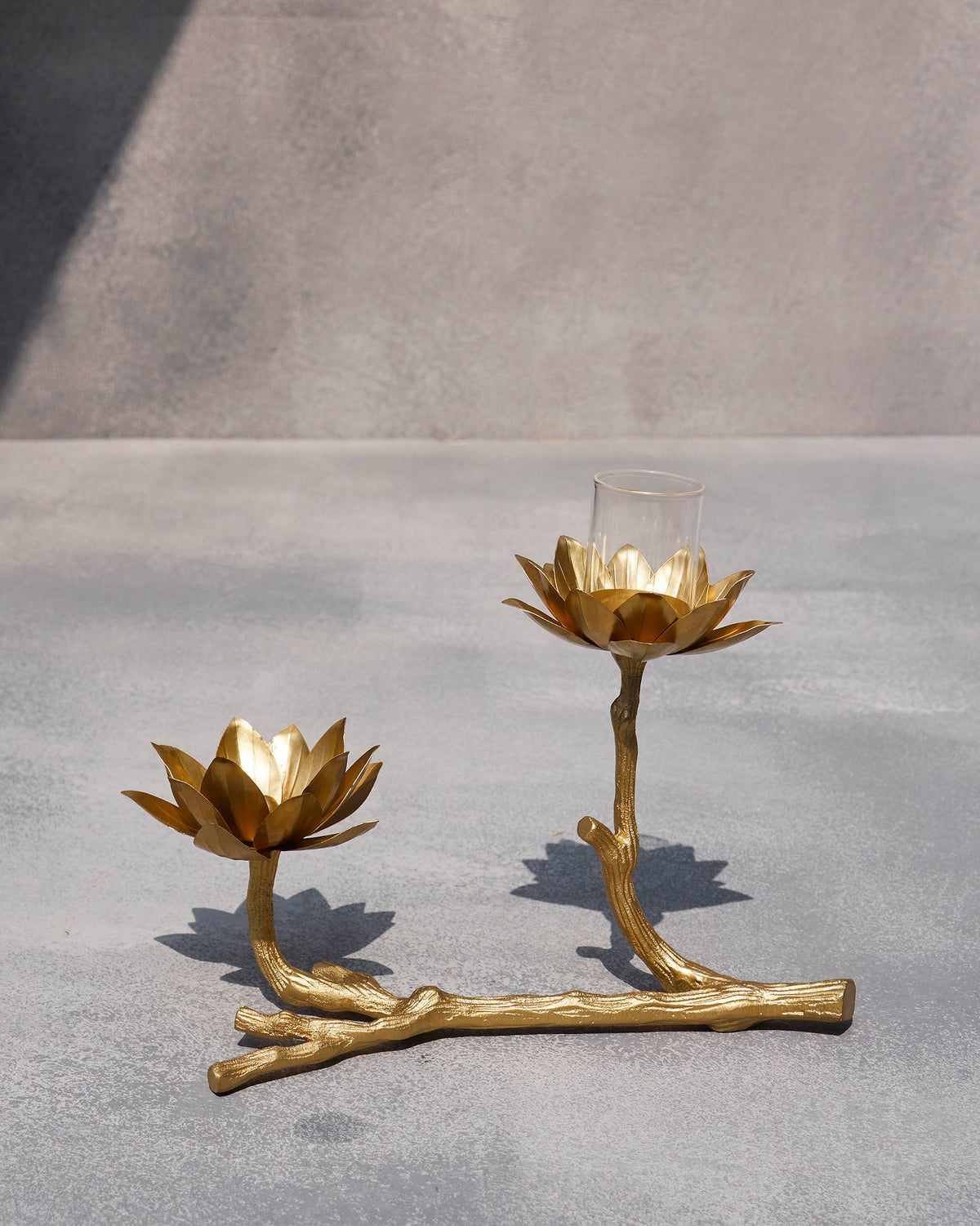 Kamal tea light holder with two gold lotus cups on a branch stand.