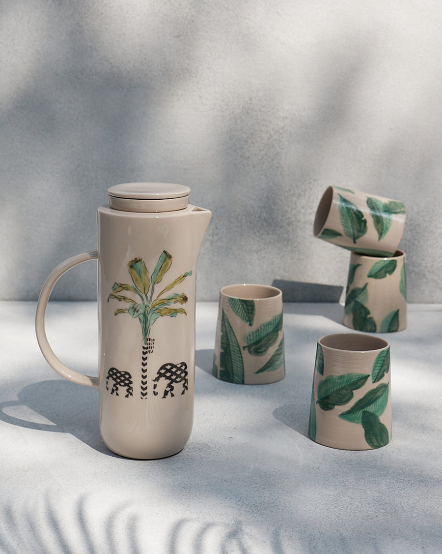 The Ele Carafe beside matching tumblers.