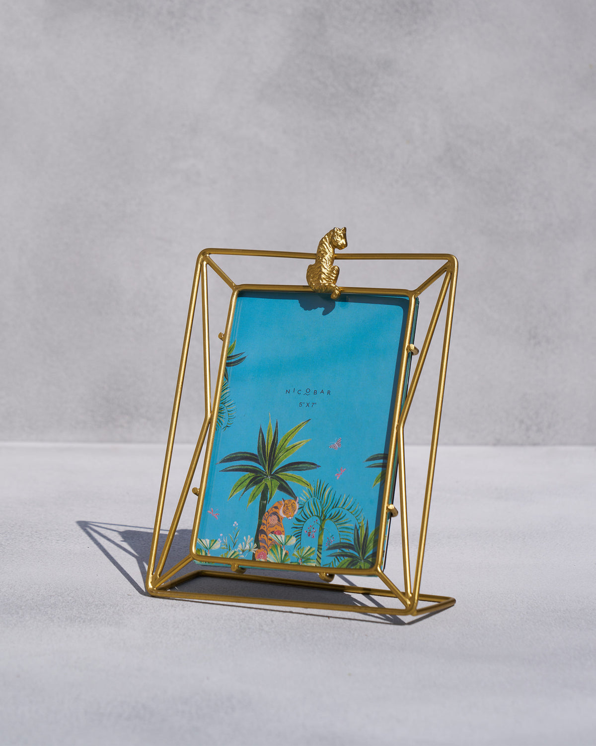 Gold woodland photo frame with a tiger motif.