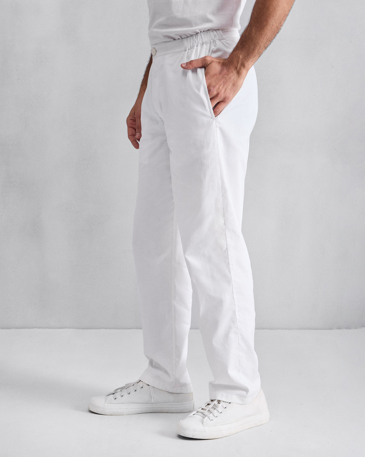 Side view of white Shillong jammies with an elasticated waist.