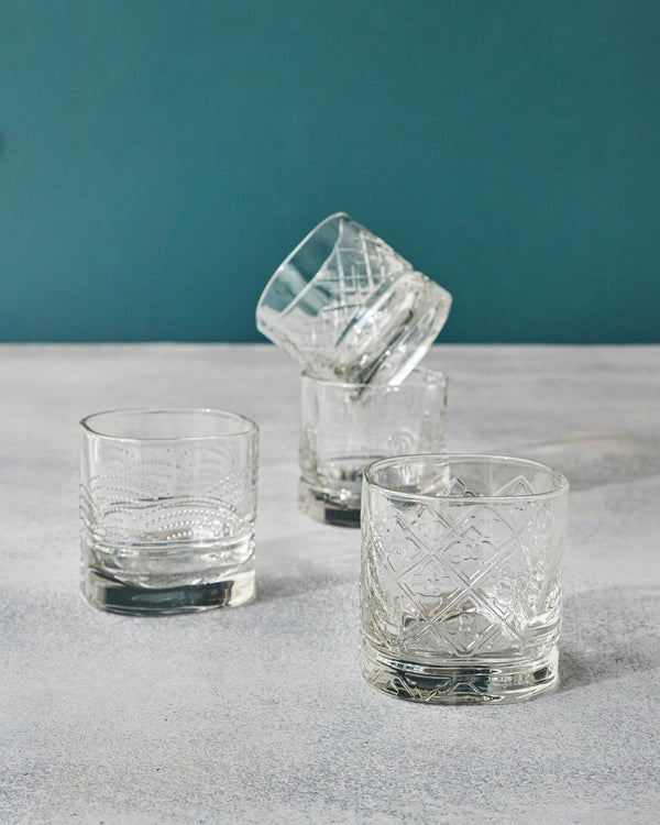 Glasses stacked and standing, showing lattice and dotted etches