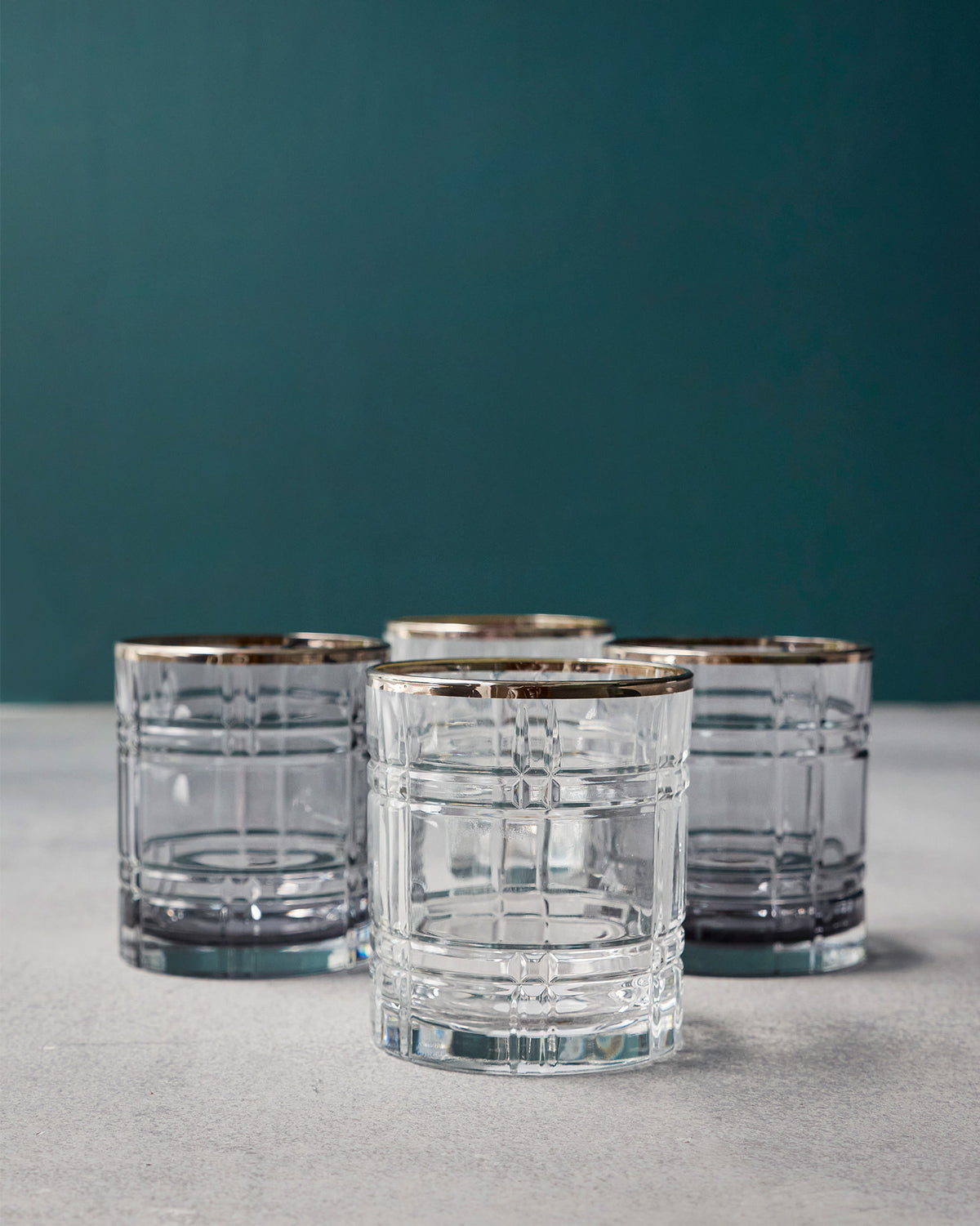Celeste tumblers showing the etched grid pattern and gold rims.