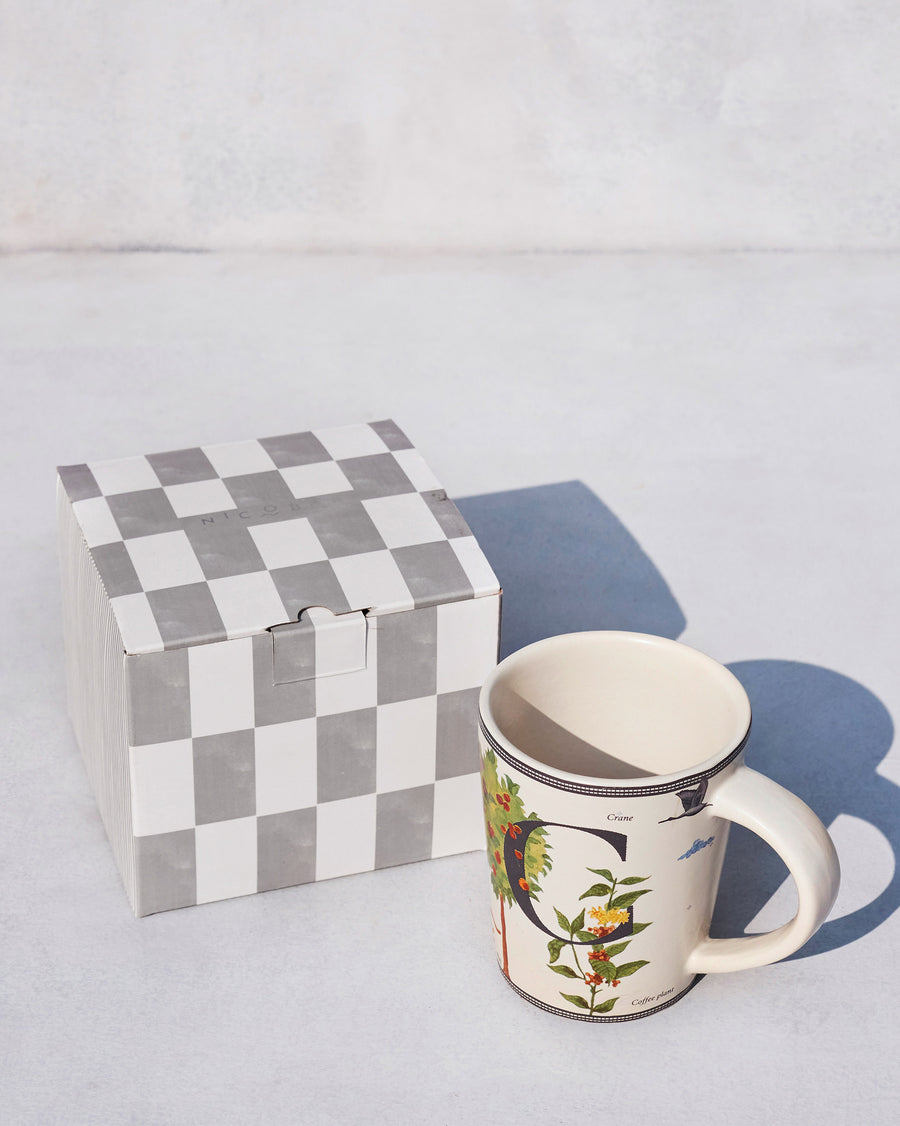 The Chameli Mug beside its chequered Nicobar gift box.