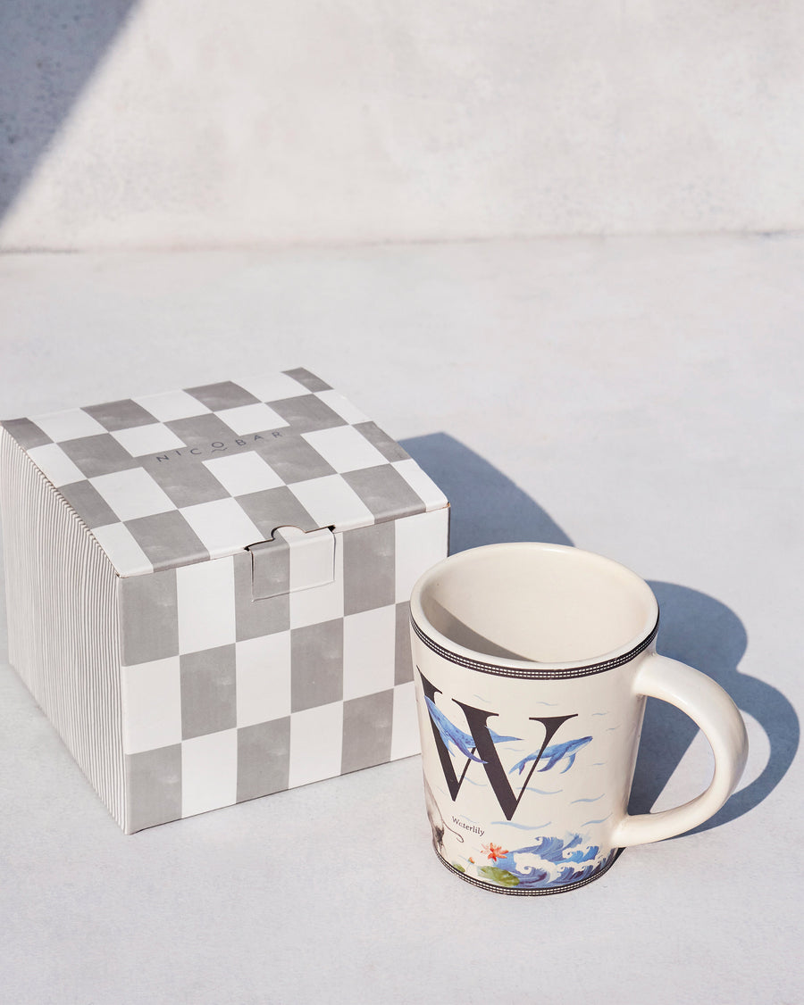 The Waterlily Mug beside its chequered Nicobar gift box.