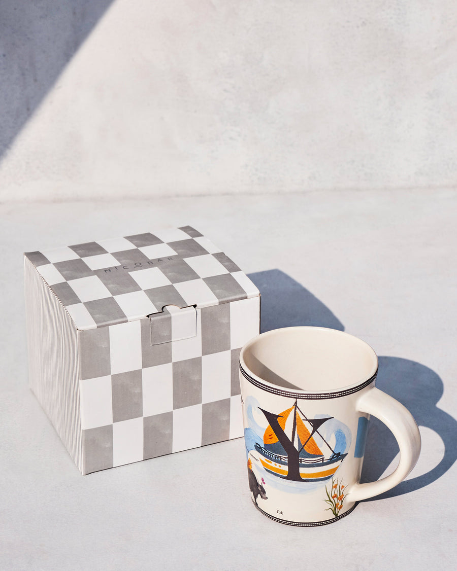 The Yoga Mug beside its chequered Nicobar gift box.
