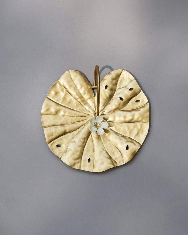 The holder from above, its arched arm in view
