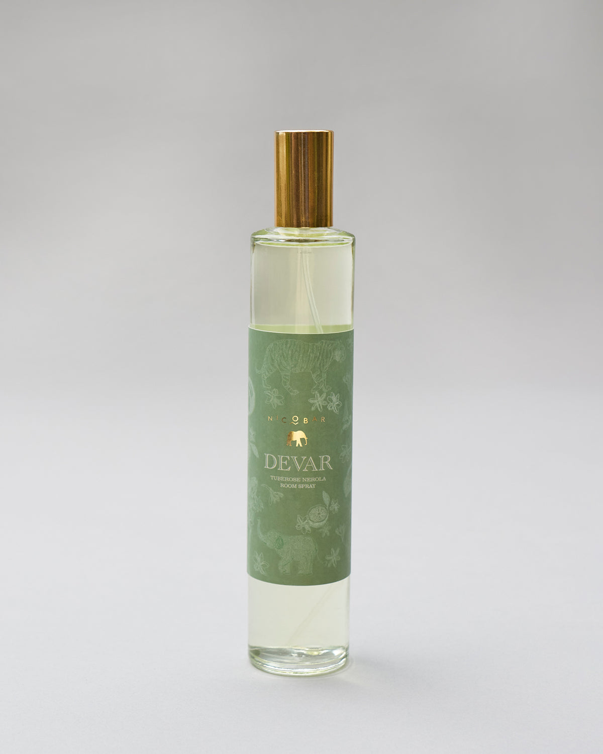 Tall glass Devar Tuberose Neroli room spray with a gold spray cap.