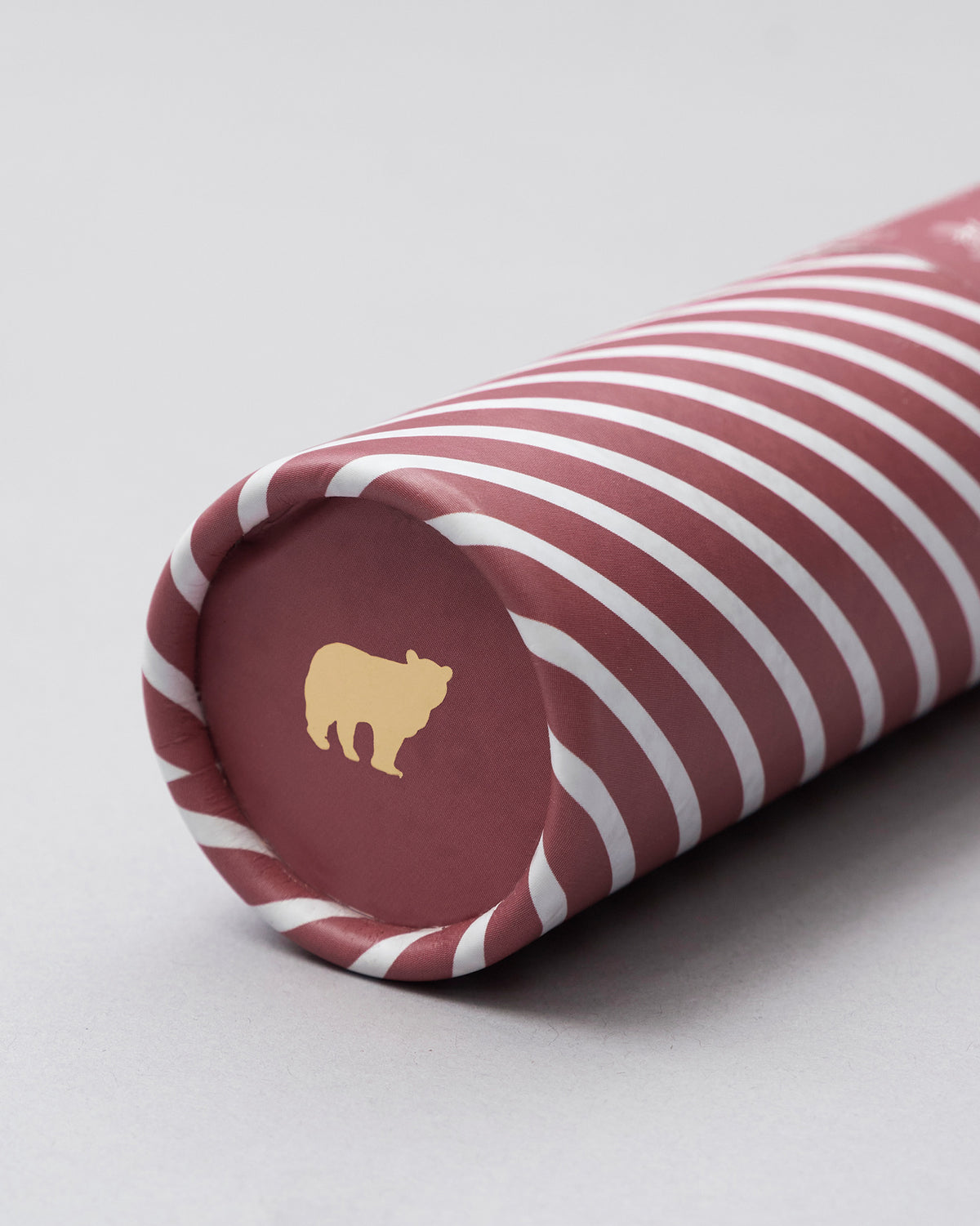 Close-up of Kandha tube packaging with gold bear logo.
