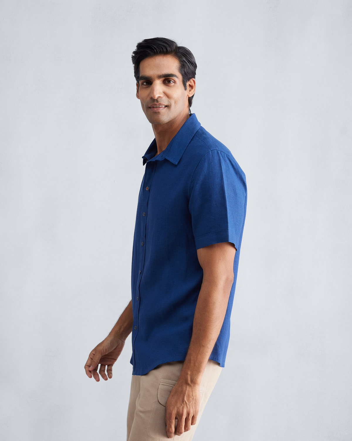 Side view of a navy Half Sleeve Shirt with a classic collar.