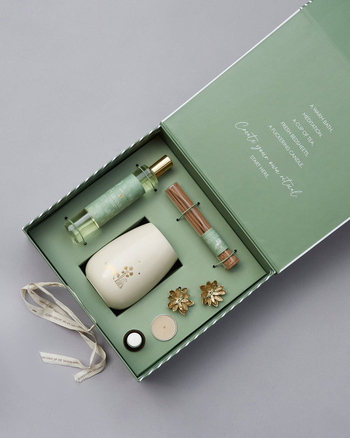 Woodland Gift Set in an open green box with a room spray, incense and a candle.