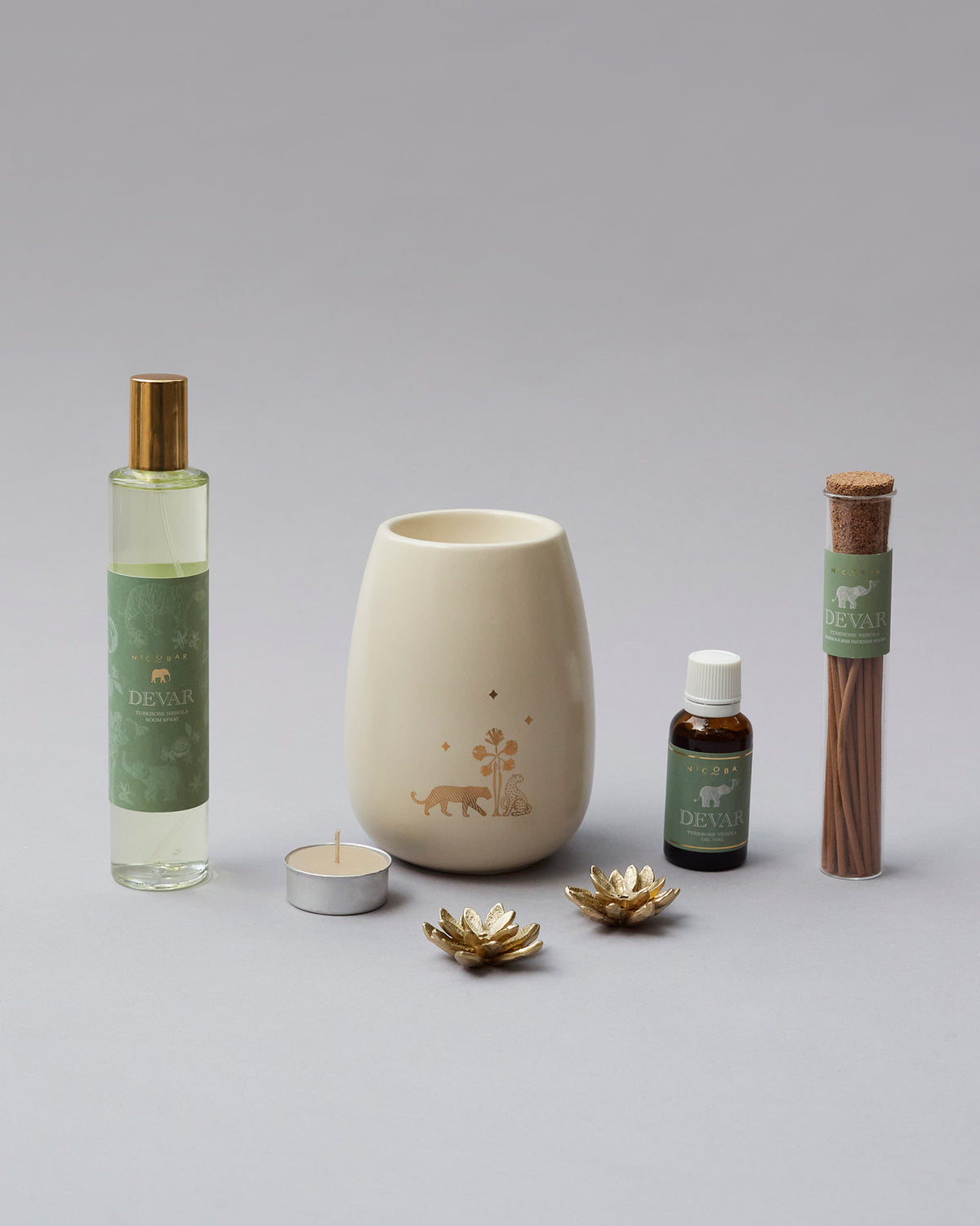 Woodland Gift Set with a cream oil burner centred between the room spray and incense.