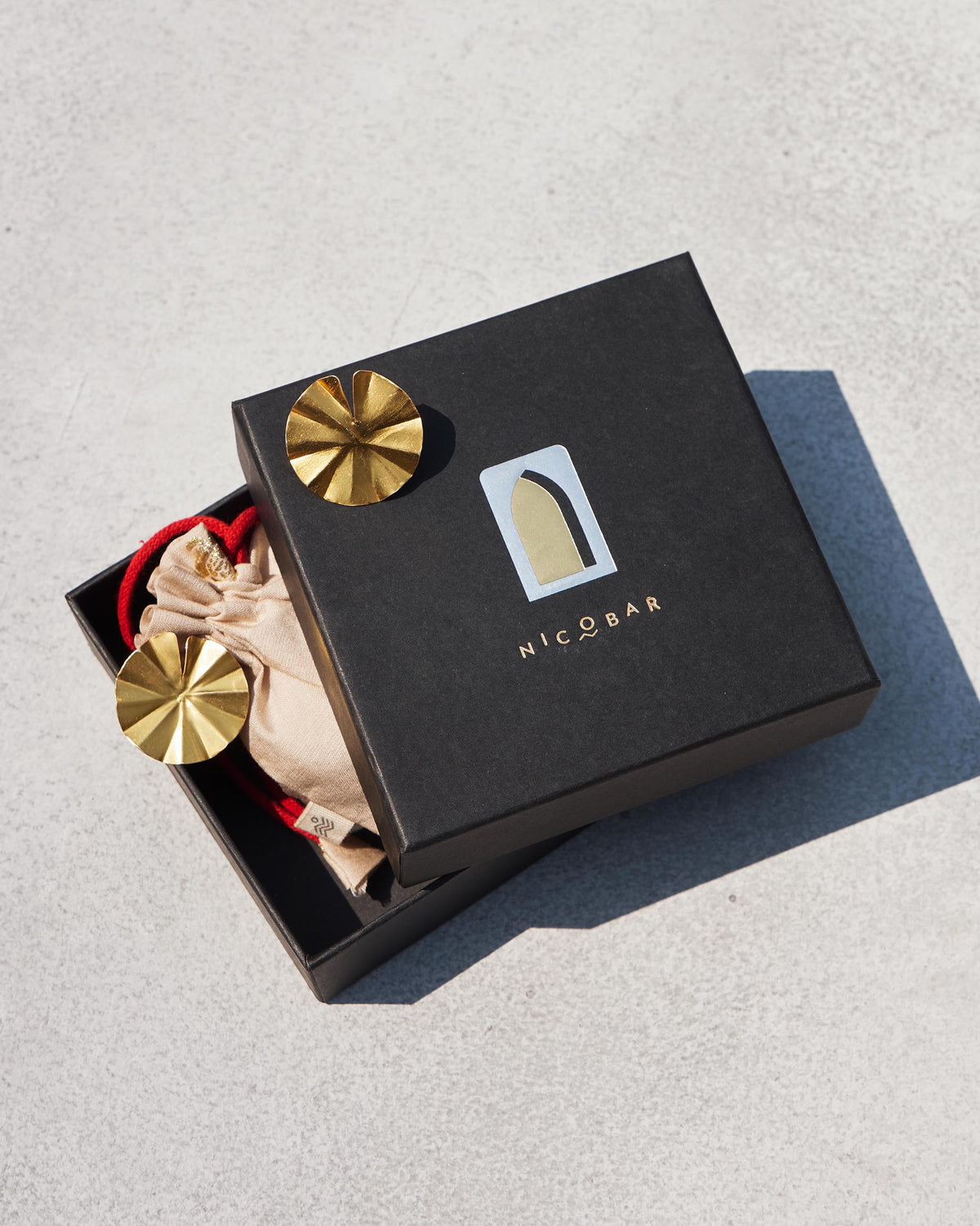 Small Lilly Pad Stud earrings in a Nicobar gift box.