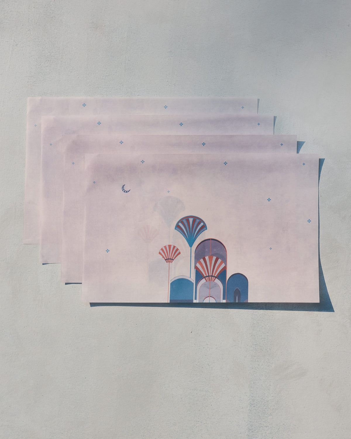 Four Tranquil Parchment Paper Rectangle sheets stacked in a staggered row, showing arch motifs.