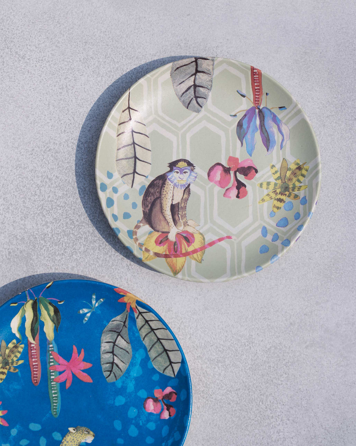 Sage Mahi quarter plate with a monkey on tropical flowers.