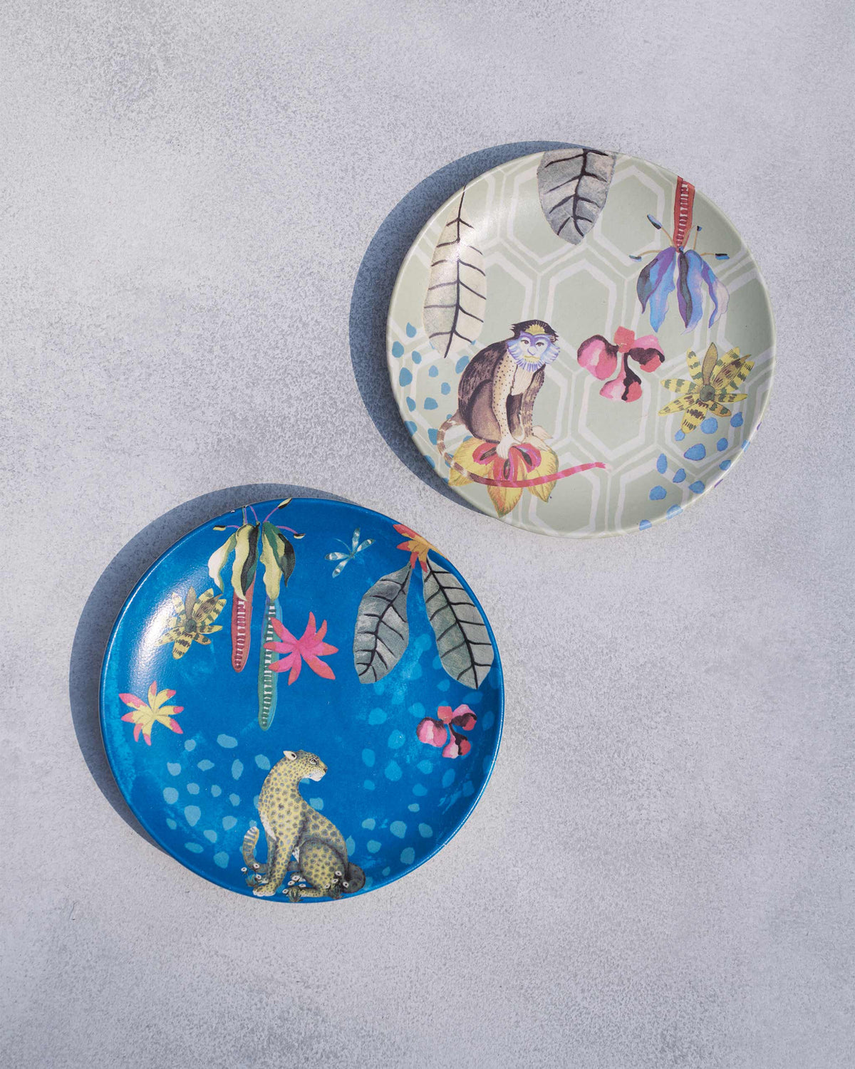 Pair of Mahi quarter plates showing monkey and leopard tropical prints.