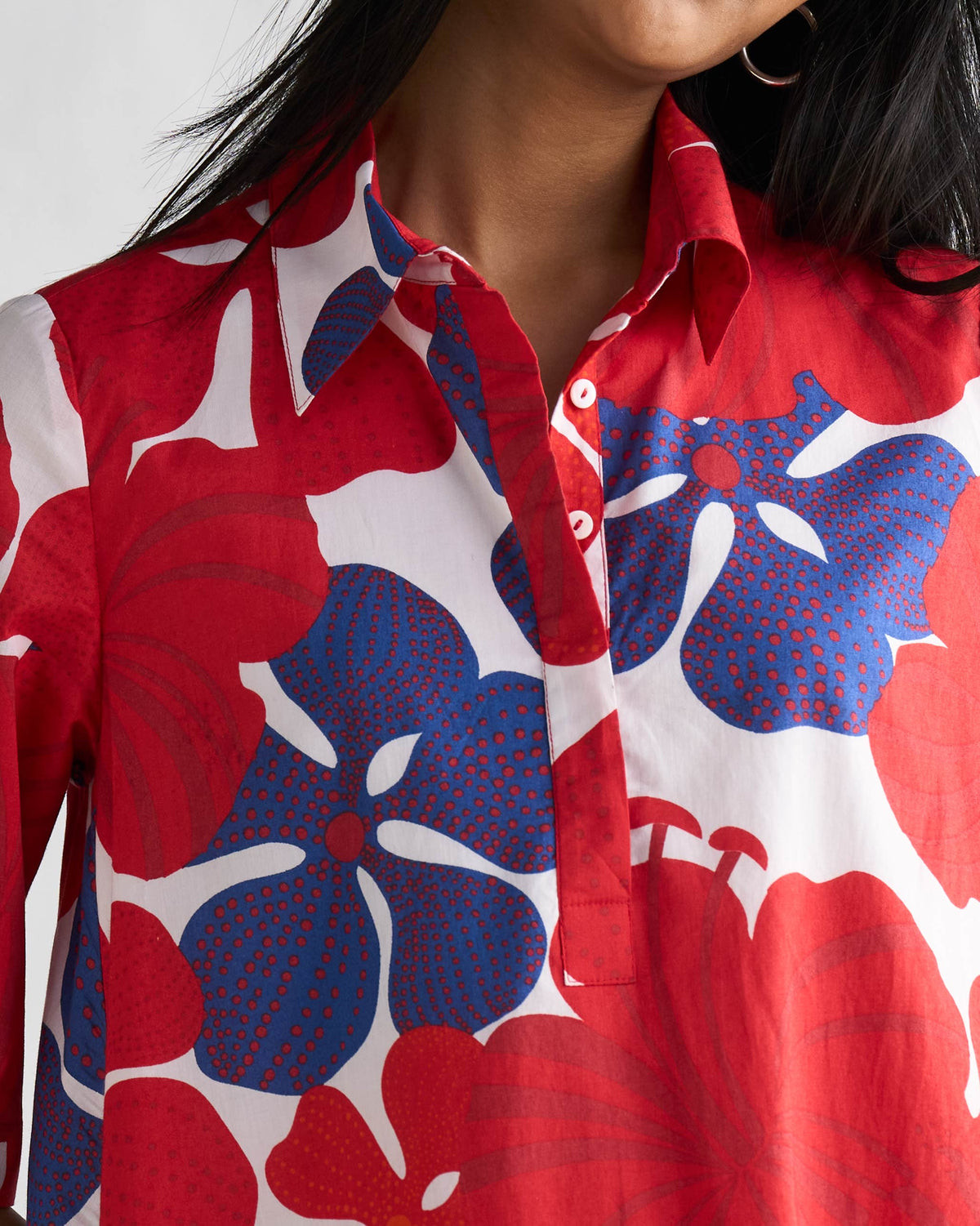 Close-up of the Happy Heart Dress collar showing red and blue hibiscus print.