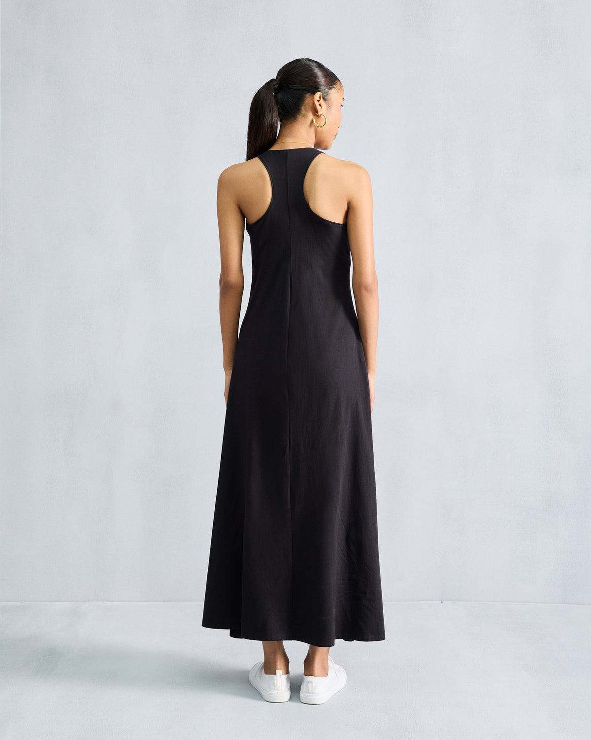 Back of a black Esther dress with a racerback and centre seam.