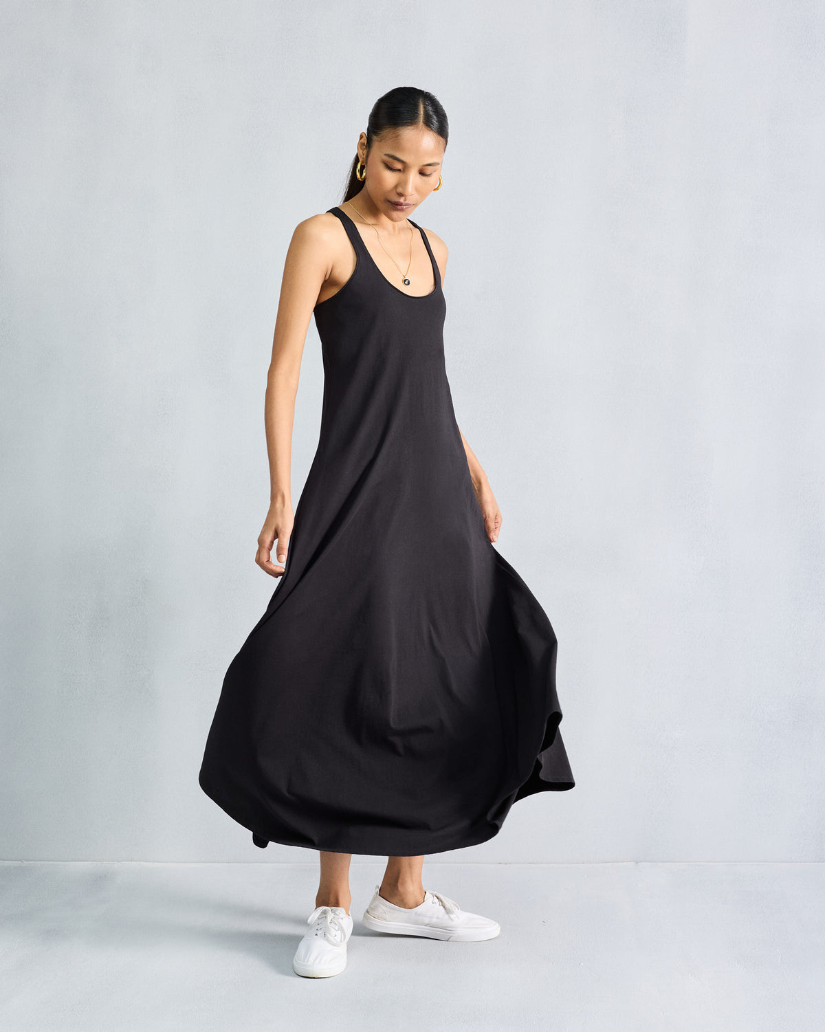 Full view of a black Esther dress with a flared A-line silhouette.