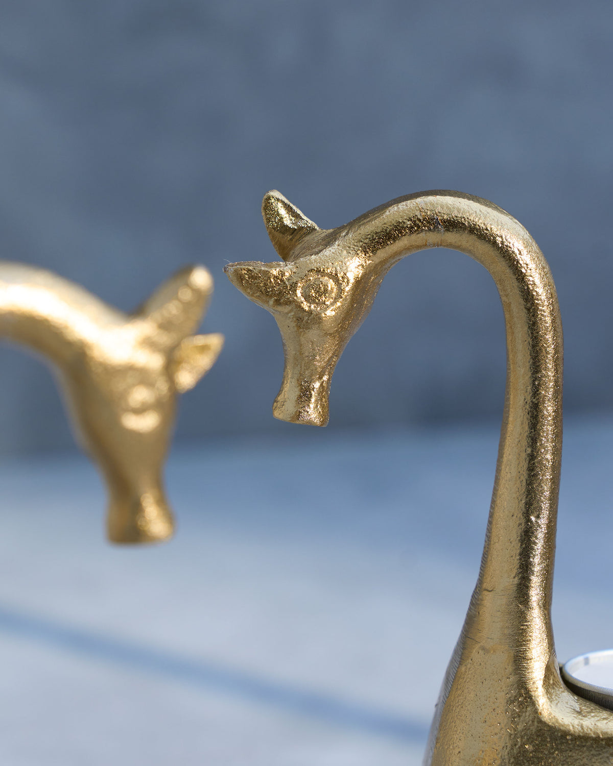 Close-up of Giraffe Tealight Holder heads showing the carved eyes and ears.